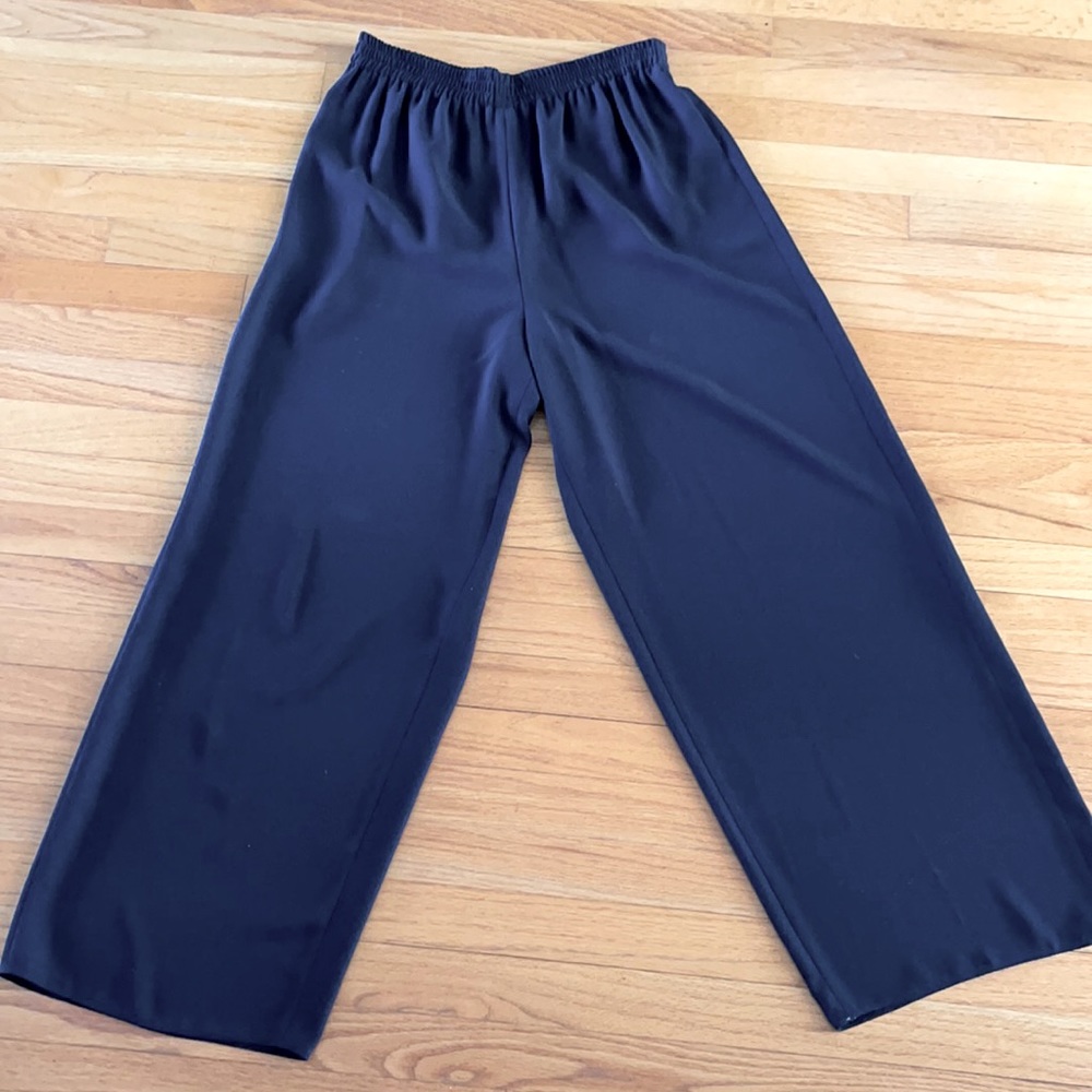 Size 14 black palazzo pants. Dress them up with a blouse or knit for evening.